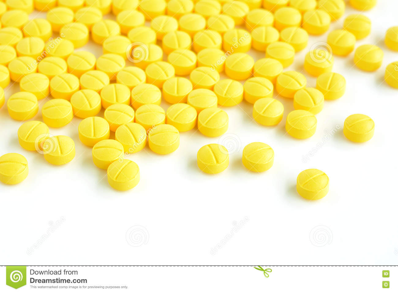 Yellow medicine tablets or pills on white background stock photo