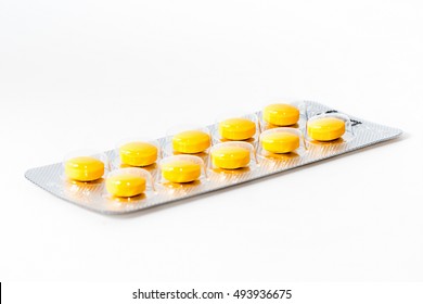 Yellow medicine tablet package isolate white stock photo