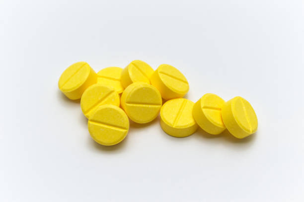 Prescription drugsmedicine of tablets or pills with yellow color on white background stock photo