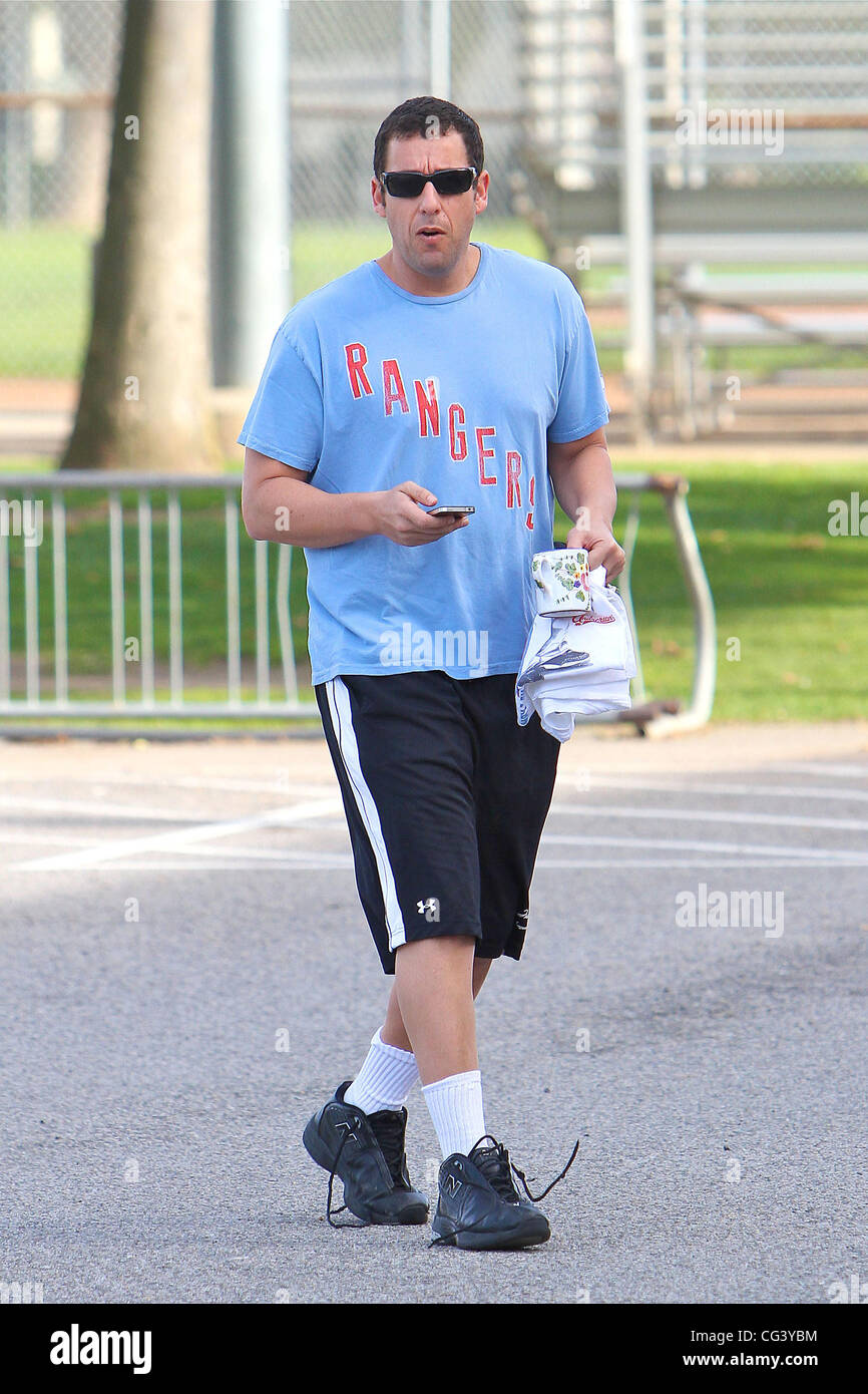 adam Sandler Uses His Cell Phone At A Game Of Basket Ball In Brentwood Los Angeles California 160111 Stock Photo Alamy